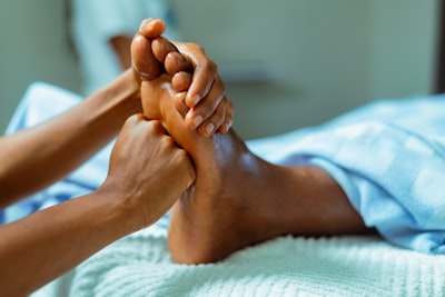 Foot is hold by the therapist during feet massage