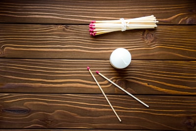 candle and long matches on the table
