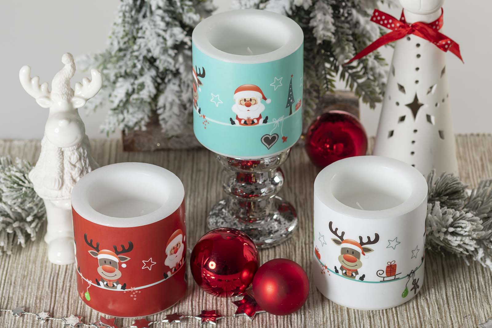 Three Christmas lanterns in company of two reindeers, Christmas bubbles and pine leaves