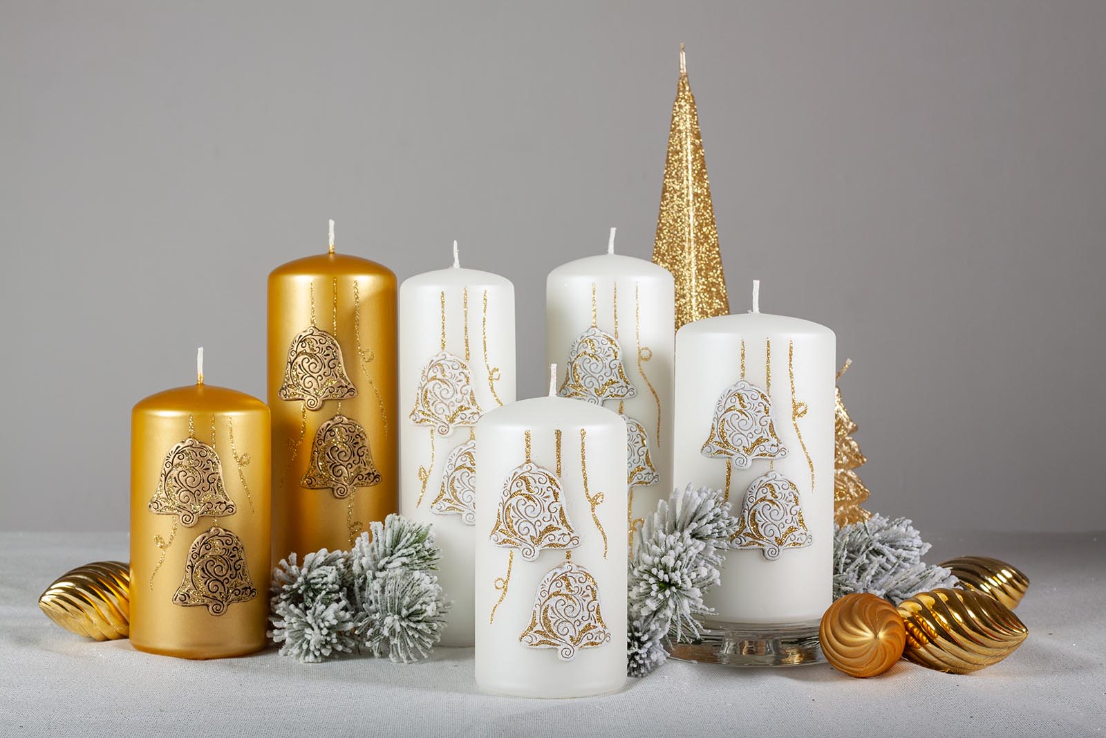Six Pillar Christmas candles surrounded by pine leaves and Christmas bubbles