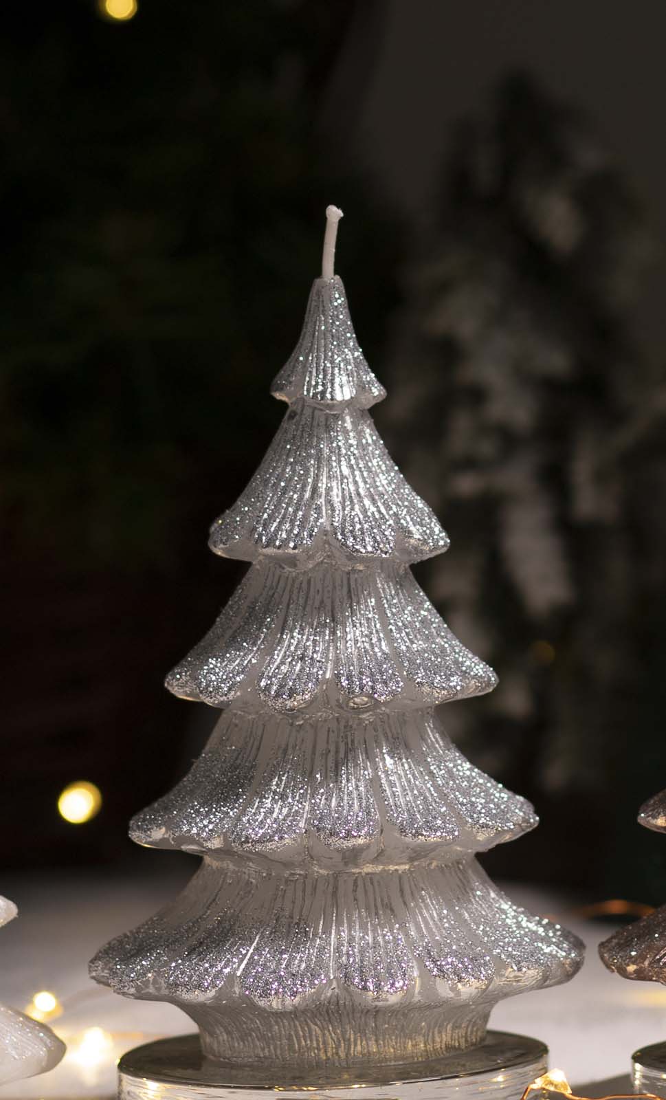 Silver candle shaped as Christmas tree